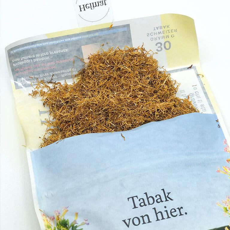 Offener 30g Beutel Heimat Tabak Hell Feinschnitt, gefüllt mit losem, hellem Schweizer Tabak